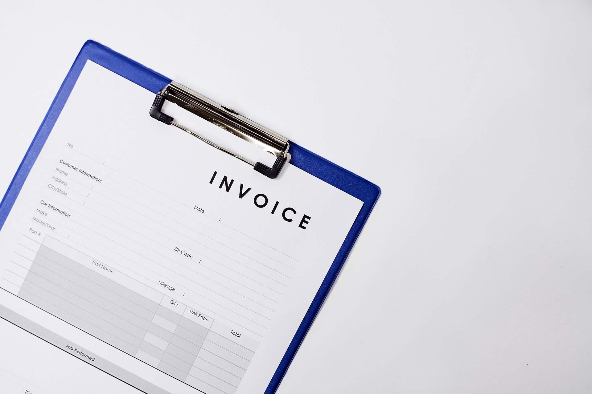Detailed invoice document on a blue clipboard, displaying fields for customer information, services, and total cost.