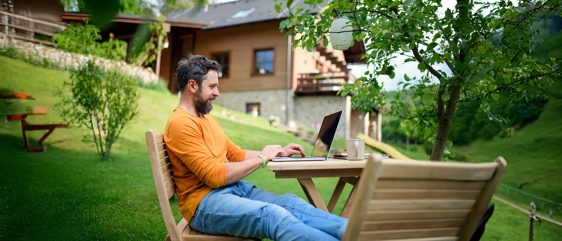 Landscaper With Laptop Working Outdoors