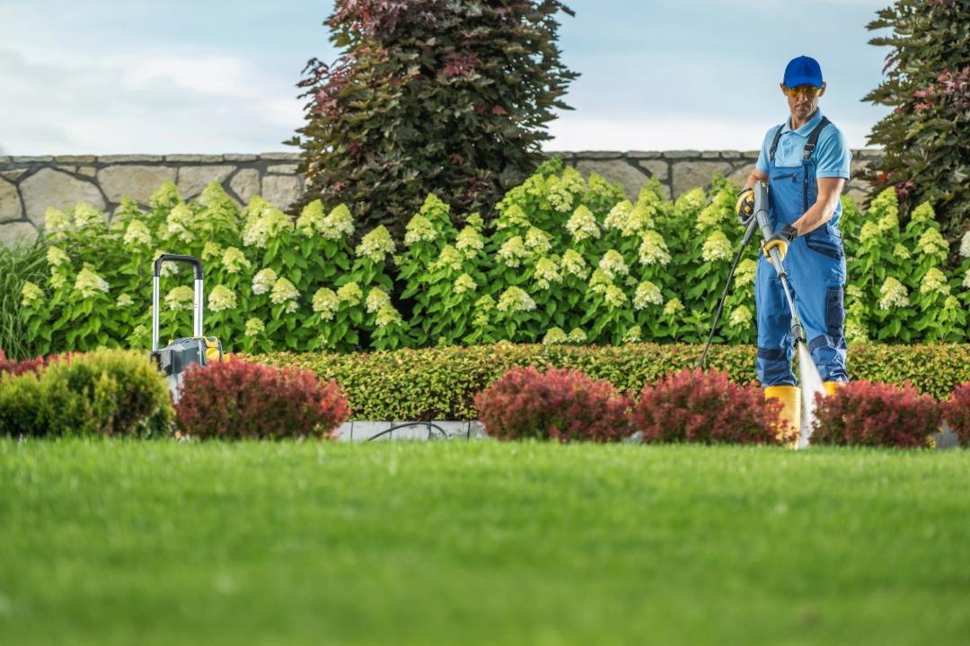 Landscaper Cleaning Residential Lawn