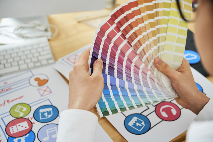 Graphic Designer Working With Color Palette