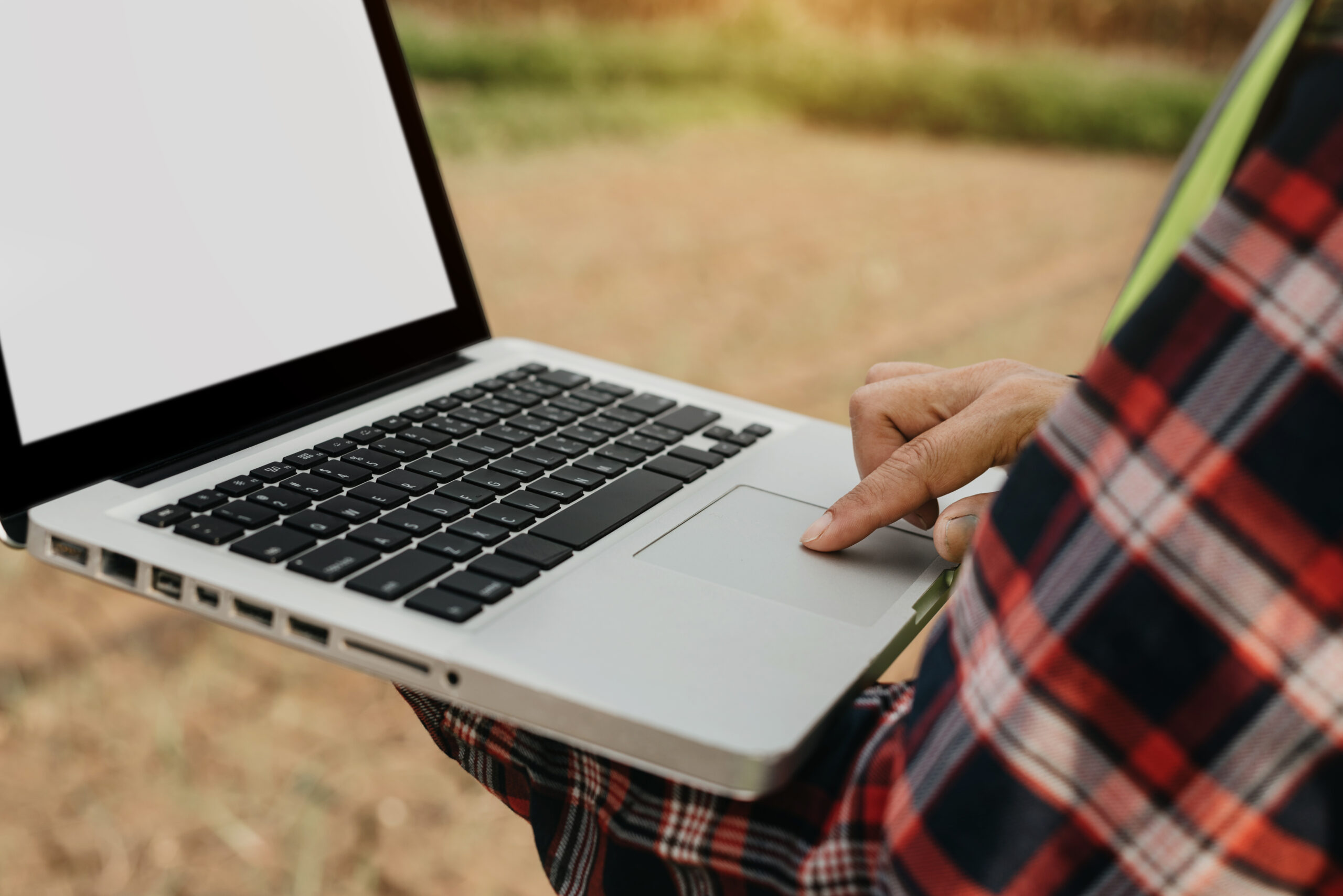 landscaper-using-laptop-to-update-website-content-